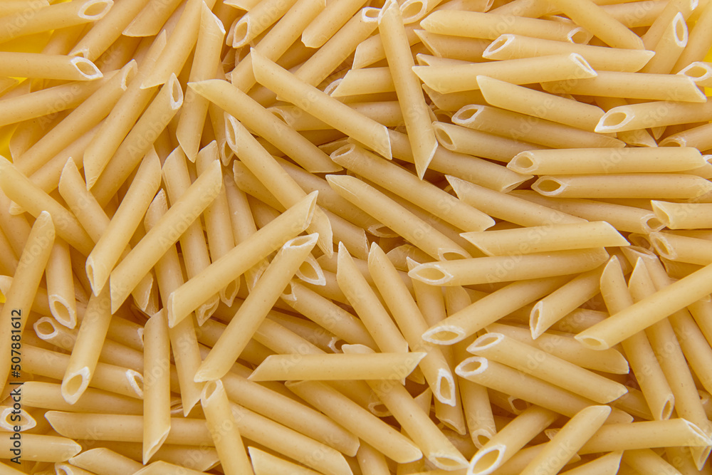 pasta feathers close-up as a culinary background