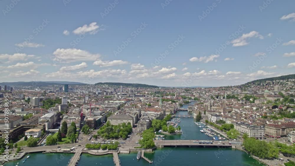 Aerial view over City of Zürich with Lake Zürich, River Limmat, Quay bridge and skyline of the old town on a sunny and cloudy spring day. Movie shot May 30th, 2022, Zurich, Switzerland. Aerial view over City of Zürich with Lake Zürich, River Limmat, Quay bridge and skyline of the old town on a sunny and cloudy spring day. Movie shot May 30th, 2022, Zurich, Switzerland.