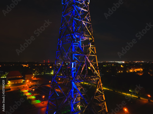 Radio station in Gliwice on night. The largest wooden tower in the world. The historic tower in Gliwice, aerial view.