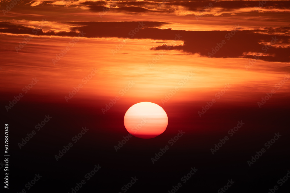 Beautiful and scenic view of sunrise and sunset with orange and red cloud during dusk and dawn with no people