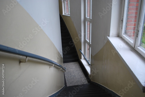 narrow, arched staircase