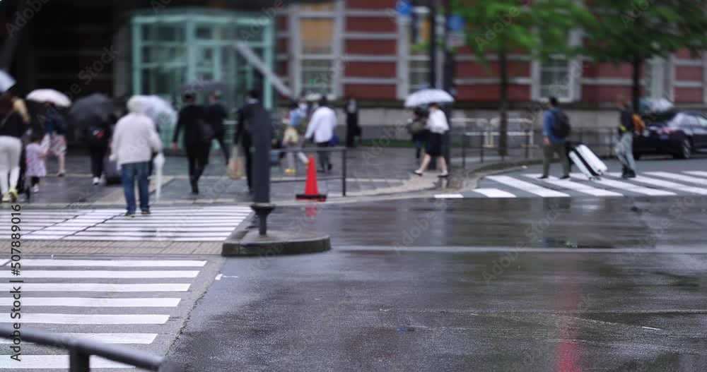 Walking people on the street in Marunouchi Tokyo rainy day Walking people on the street in Marunouchi Tokyo rainy day