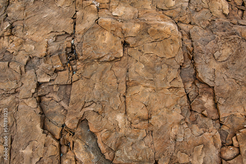 Natural background of red stone texture. Surface of the mountain © darkbird