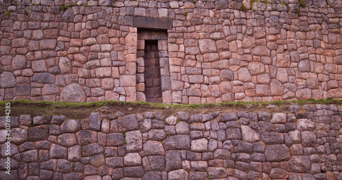 Ancient Inca walls with opening in Cusco, Peru