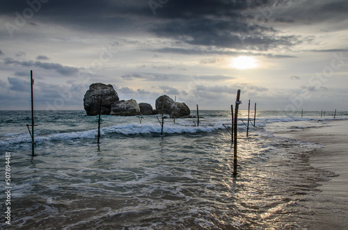 Pole for fishing at sunset in the south of Sri Lanka 