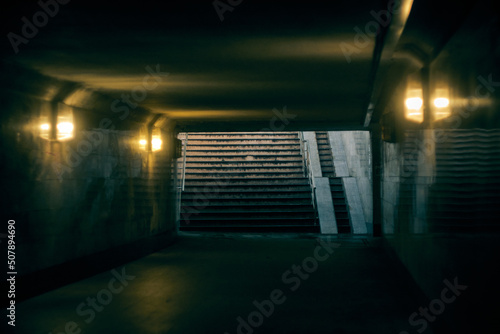 the dark gloomy tunnel of the underpass photo