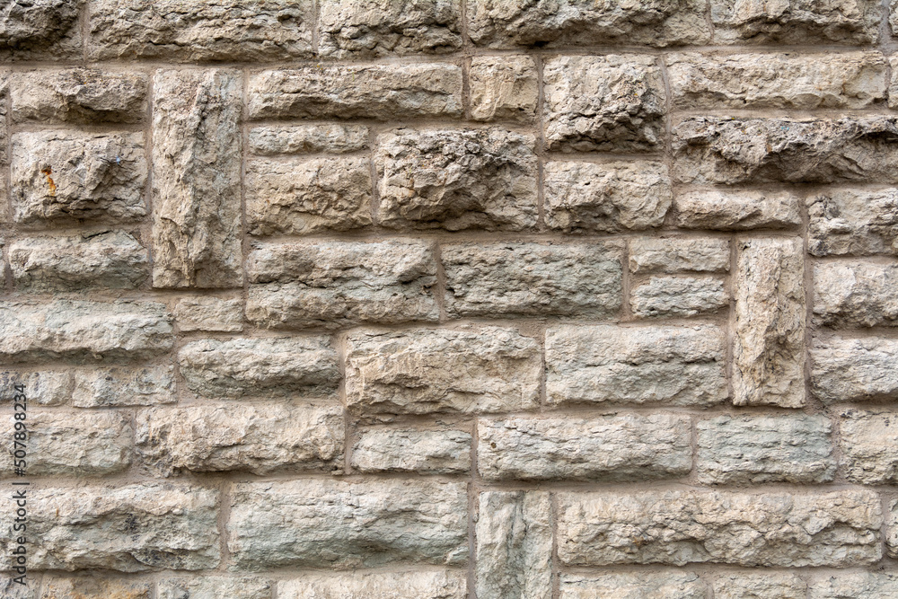 Stonewall background structure. Texture of an old Wall made of rough stones Stonewall background structure. Texture of an old Wall made of rough stones