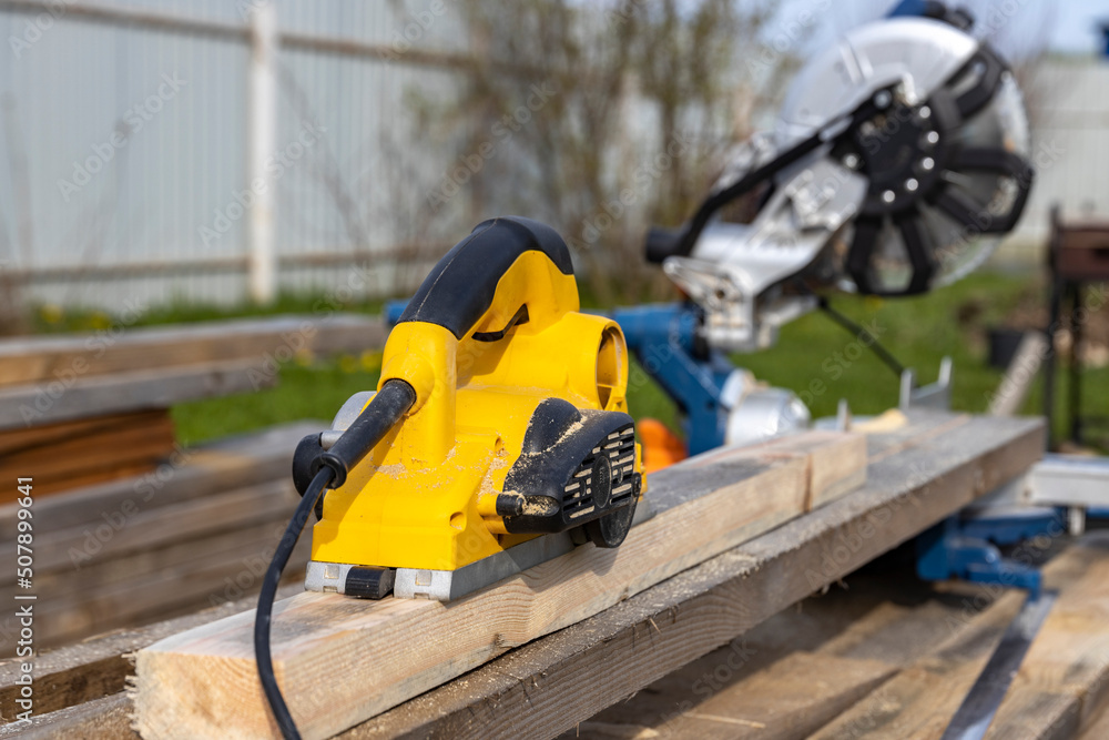 Planer close-up. Carpentry, Woodworking tool at work.