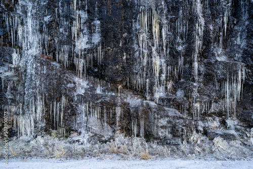 frozen rock rock where large icicles are frozen