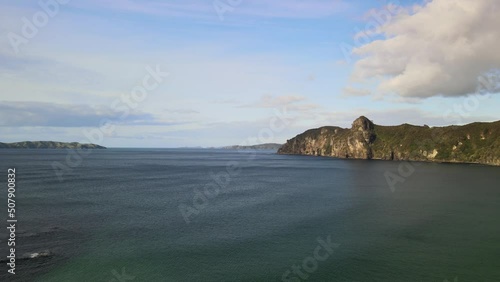 Flying over clifftops in New Zealand's Bay of Islands