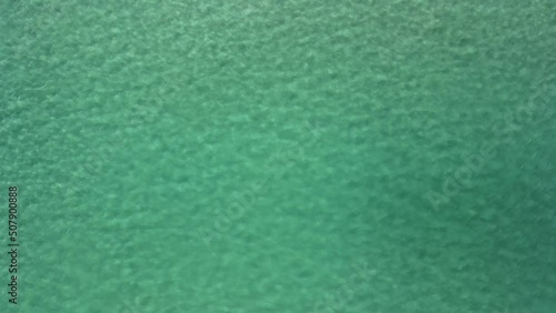 Aerial view of tidal swell with crystal clear clarity