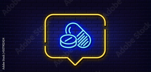 Neon light speech bubble. Medical drugs line icon. Medicine pills sign. Pharmacy medication symbol. Neon light background. Medical drugs glow line. Brick wall banner. Vector