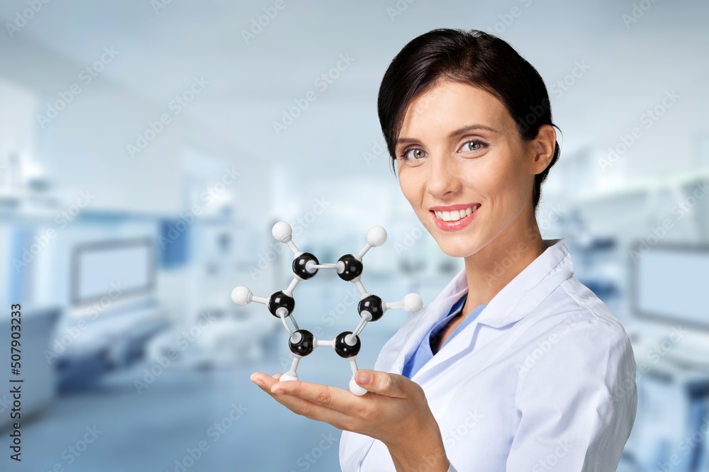 Scientist with a model of mockup made of molecules. Properties of