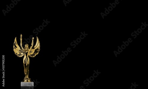 Beautiful Golden award statue against dark background.
