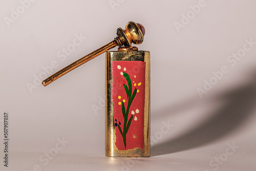 Antiguo y oxidado botecito de perfume photo