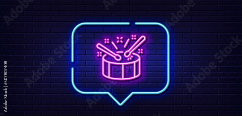 Neon light speech bubble. Drums with drumsticks line icon. Music sign. Musical instrument symbol. Neon light background. Drums glow line. Brick wall banner. Vector