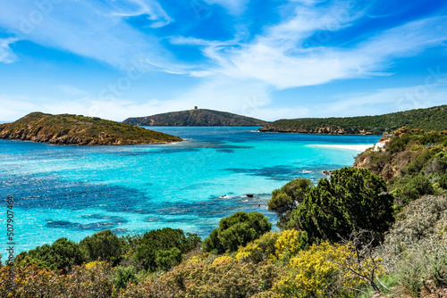 Overview of the island of Tuerredda, located in southern Sardinia. Tuerredda beach during a sunny day with breathtaking sky. © Yaya Photos