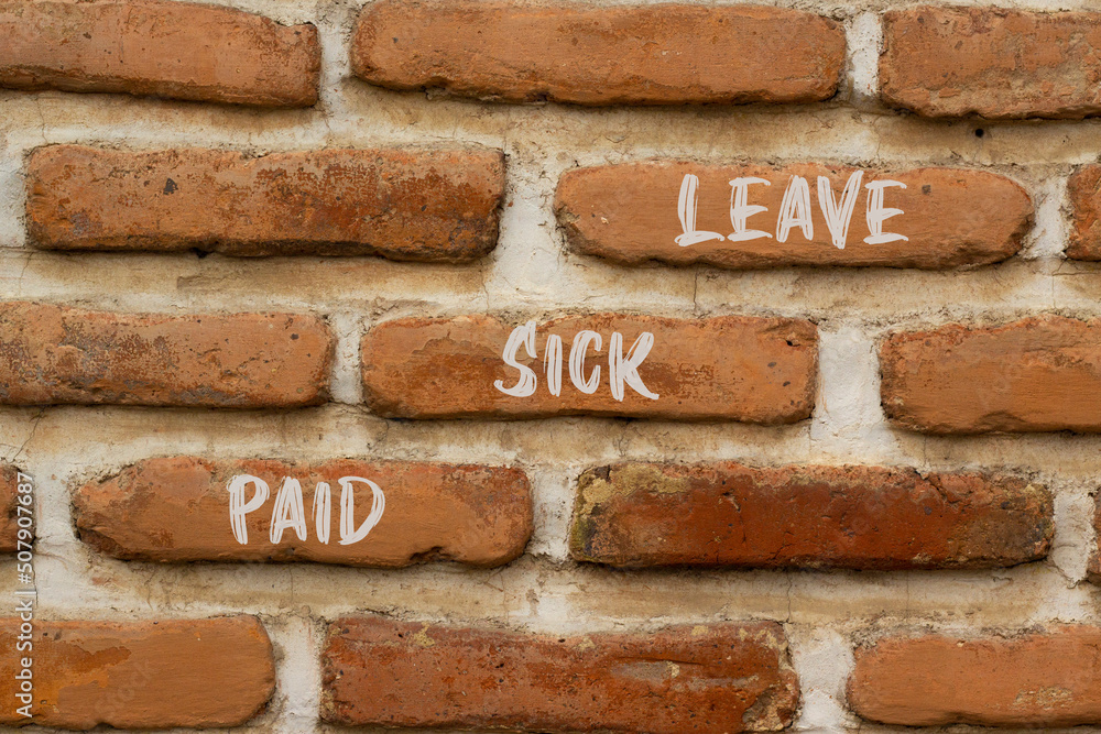 Paid sick leave symbol. Concept words Paid sick leave on brick wall. Beautiful brick wall background. Business medical and paid sick leave concept. Copy space. Paid sick leave symbol. Concept words Paid sick leave on brick wall. Beautiful brick wall background. Business medical and paid sick leave concept. Copy space.