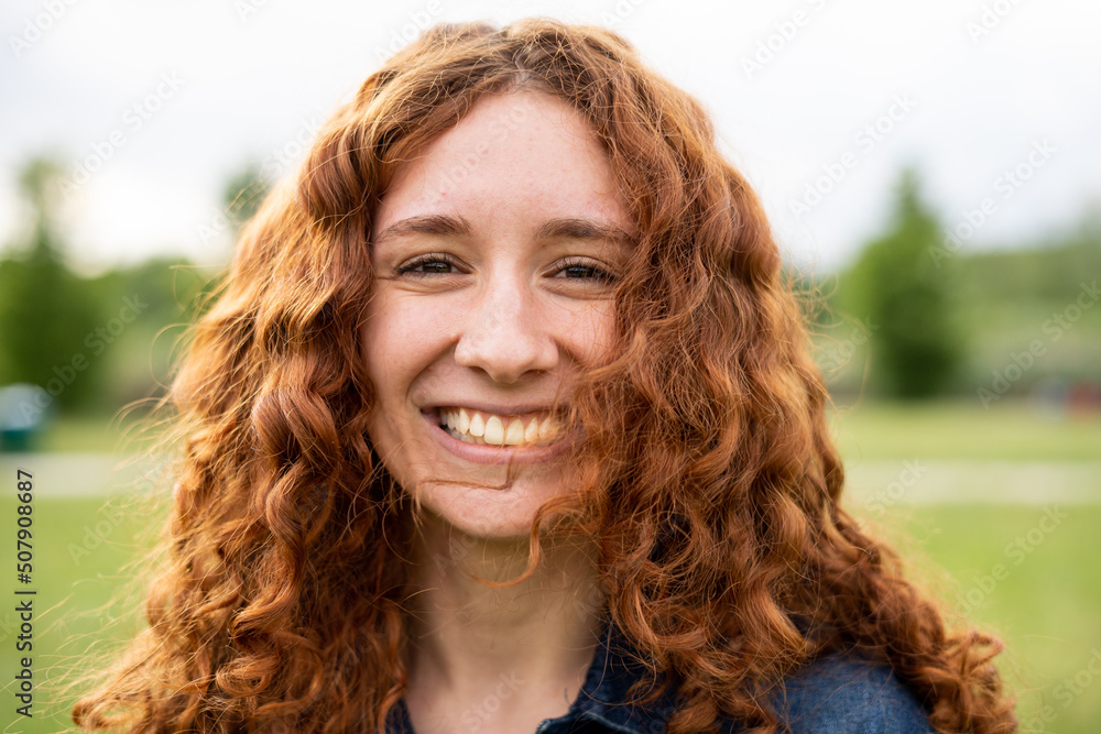 Obraz premium Portrait of young girl with red hair