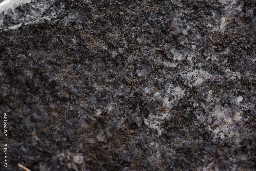 Texture of old raw granite close-up Texture of old raw granite close-up