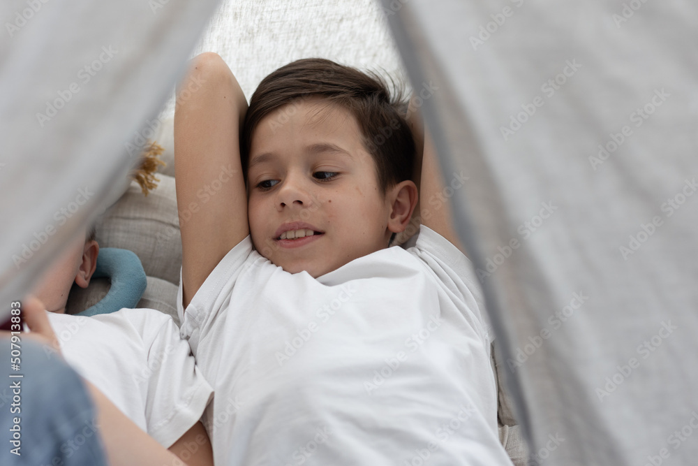 Two brothers under the camping tent Two brothers under the camping tent