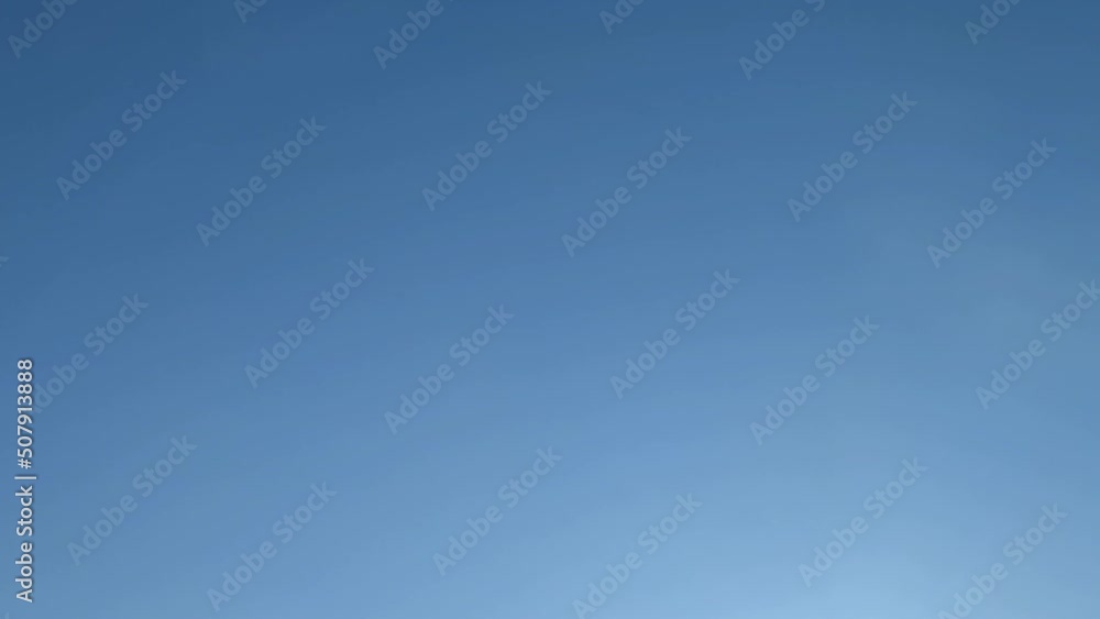 Almost clear blue skies. Rare cumulus clouds quickly fly across the light blue sky. They change their shape and size on the go, dissolve and appear out of nowhere. Almost clear blue skies. Rare cumulus clouds quickly fly across the light blue sky. They change their shape and size on the go, dissolve and appear out of nowhere.