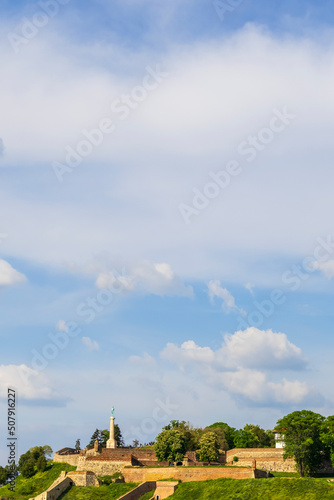 White clouds in the blue sky above the Kalemegdan Fortress on a beautiful sunny day. Background. Belgrade, Serbia.