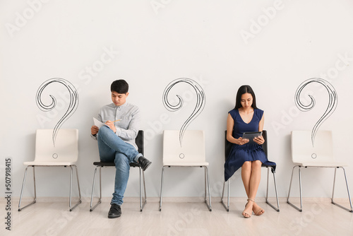 Young Asian people waiting ...