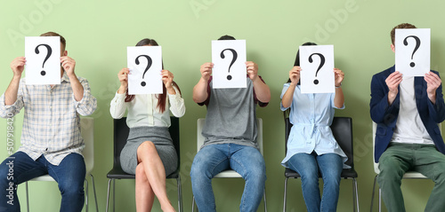 Young people holding paper ...