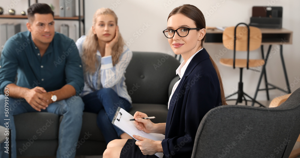 Psychologist working with young couple in office Psychologist working with young couple in office