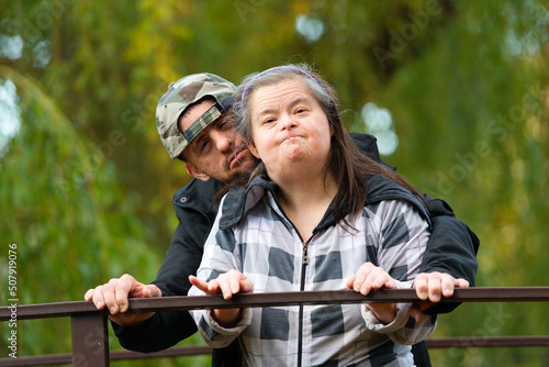 Down syndrome love couple in park