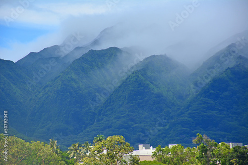 Manoa valley landscape with Koolau mountains and clouds creeping in the valley in Honolulu on Oahu, Hawaii photo