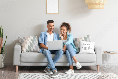 Young couple with laptop vi...