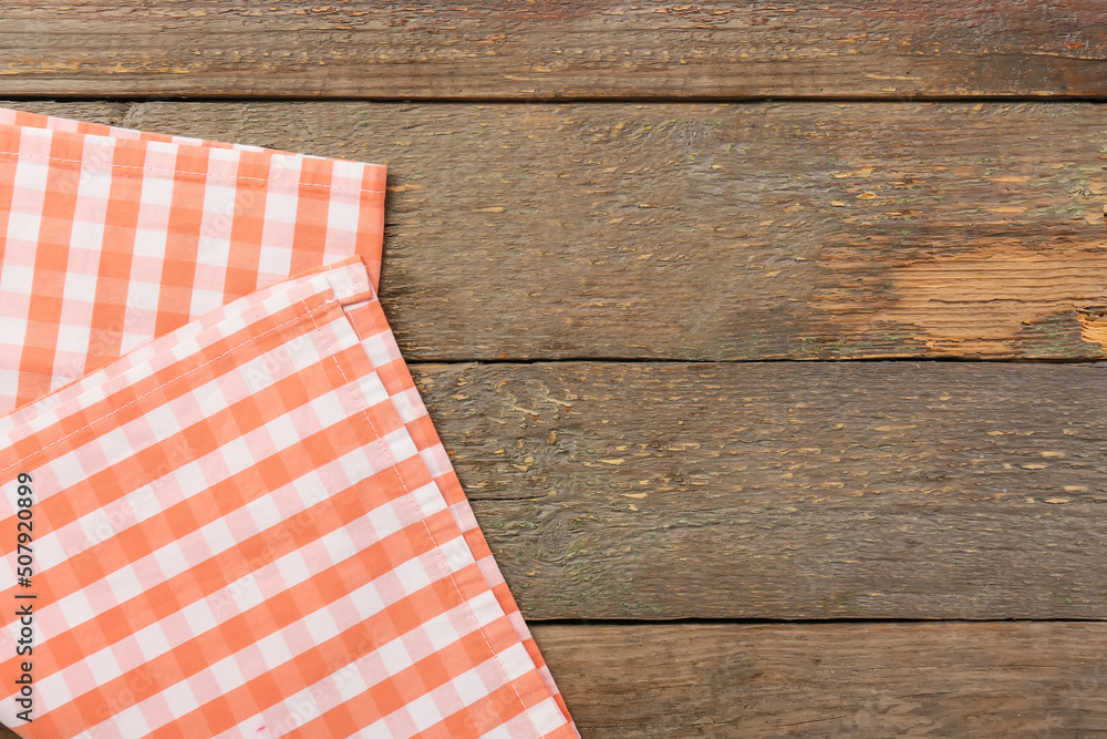 Obraz premium New checkered napkins for picnic on wooden background