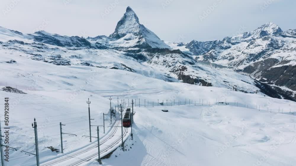 Swiss beauty, a rack railway going to Gornergrat train station under breathtaking Matterhorn, Zermatt, Valais, Switzerland, Europe. A train through Switzerland. Swiss beauty, a rack railway going to Gornergrat train station under breathtaking Matterhorn, Zermatt, Valais, Switzerland, Europe. A train through Switzerland.