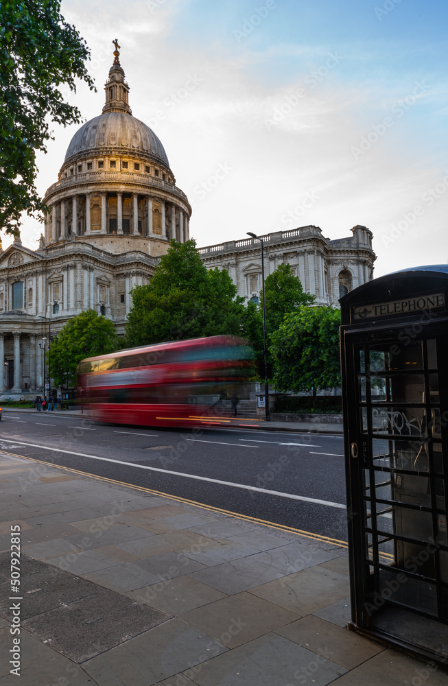 St. Pauls Cathedral view from the other side of the street wil light trails from the bus 