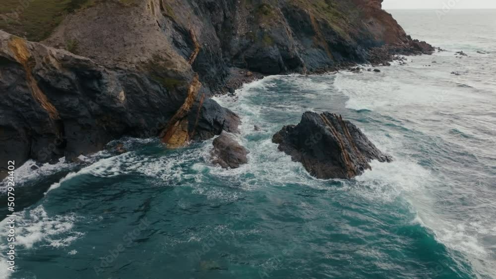 waves break in slow motion on rocks in atlantic ocean portugal drone aerial view waves break in slow motion on rocks in atlantic ocean portugal drone aerial view