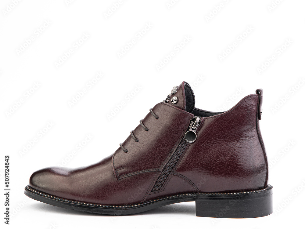Men's autumn brown leather jodhpur boots with laces and average heels, isolated white background. Left side view. Fashion shoes. Men's autumn brown leather jodhpur boots with laces and average heels, isolated white background. Left side view. Fashion shoes.