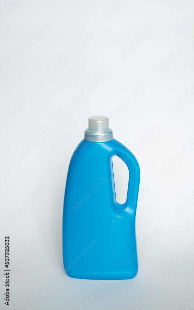 Large blue plastic bottle with gel for washing isolated on a white background. Laundry container, merchandise template. Large blue plastic bottle with gel for washing isolated on a white background. Laundry container, merchandise template.