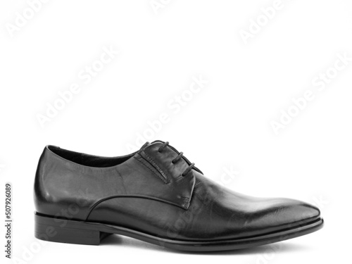 Obraz na płótnie A pair of classic leather elegant men's shoes isolated white background. Groom's stylish black shoes. Isolated object close up on white background. w salonie