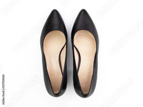 Classic and elegant high-heeled women shoes. Stylish black shoes on high thin heels and with a pointed toe. Isolated object close up on white background. Top view.