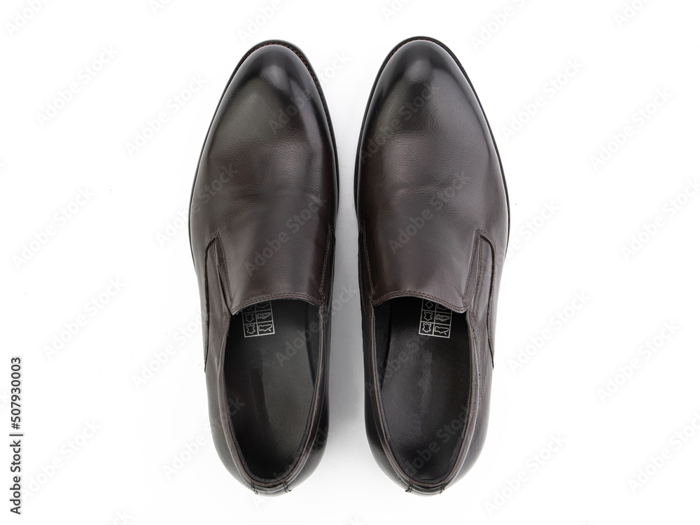 A pair of classic leather elegant men's shoes isolated white background. Groom's stylish black shoes. Isolated object close up on white background.