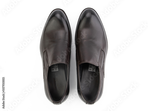 A pair of classic leather elegant men's shoes isolated white background. Groom's stylish black shoes. Isolated object close up on white background.