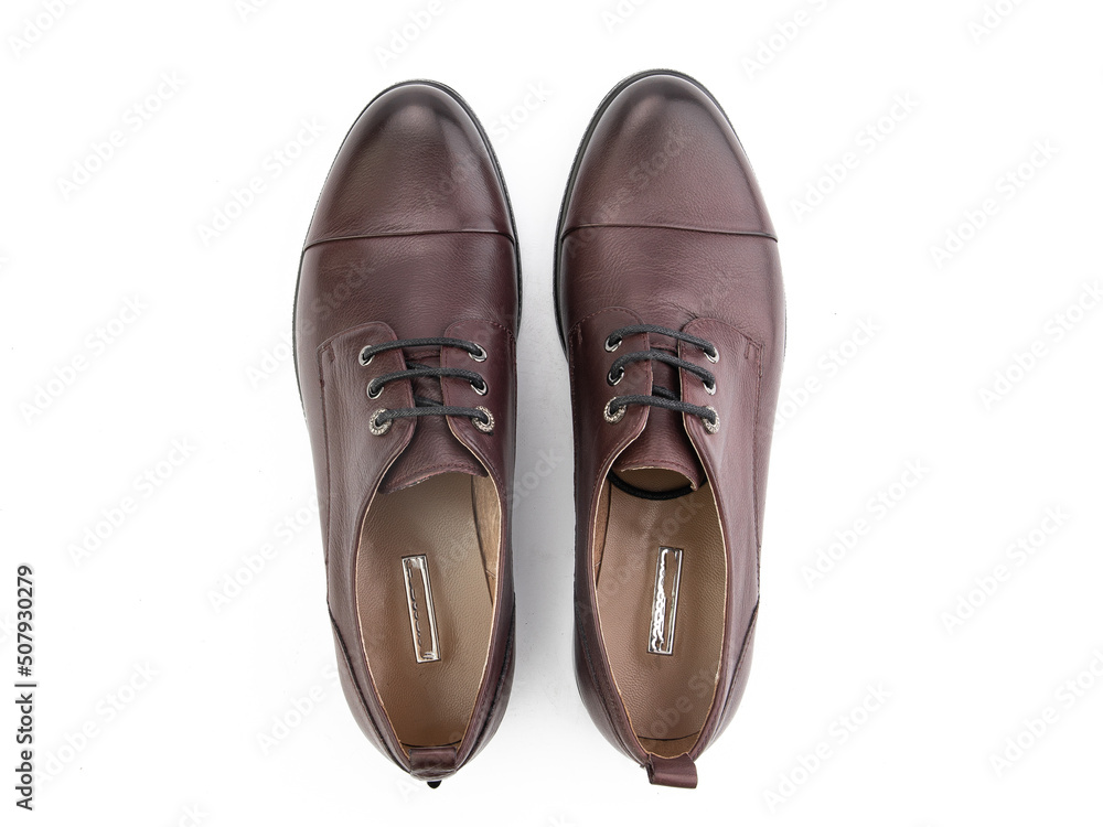 A pair of classic leather elegant men's shoes isolated white background. Groom's stylish black shoes. Isolated object close up on white background.