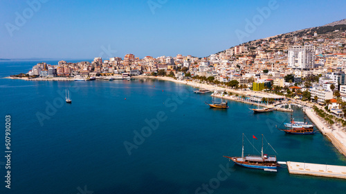 Fototapeta Naklejka Na Ścianę i Meble -  Aerial view of the resort town of Saranda, located on the coast of the Ionian Sea, Albania