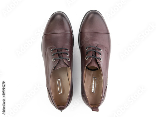 Obraz na płótnie A pair of classic leather elegant men's shoes isolated white background. Groom's stylish black shoes. Isolated object close up on white background. w salonie