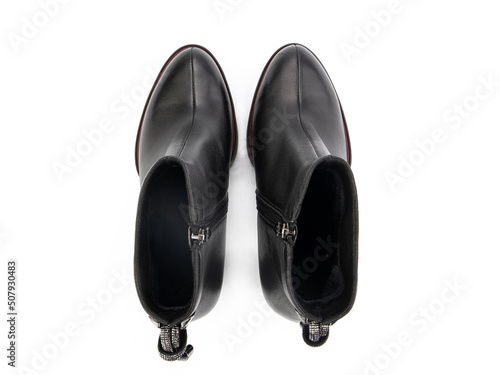 Obraz na płótnie black leather jodhpur boots isolated on white background. Top view. Fashion shoes. Photoshoot for shoe shop concept. w salonie