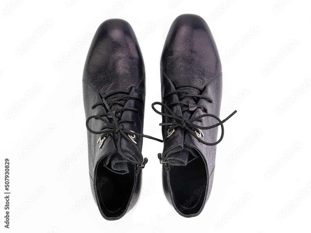 A pair of classic leather elegant men's shoes isolated white background. Groom's stylish black shoes. Isolated object close up on white background.