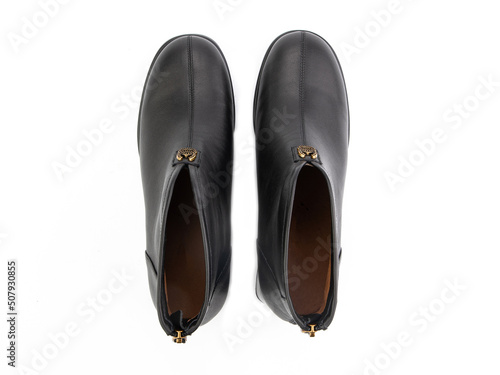 Obraz na płótnie black leather jodhpur boots isolated on white background. Top view. Fashion shoes. Photoshoot for shoe shop concept. w salonie