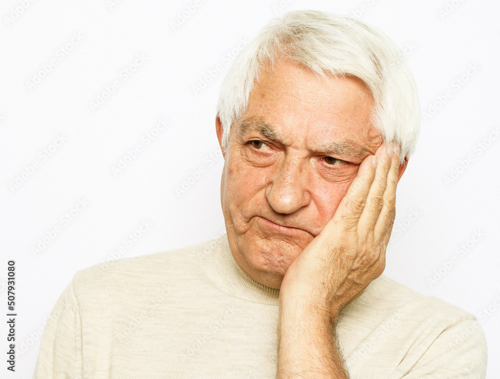 lifestyle, health and old people concept: Portrait of an old man having a toothache against white background lifestyle, health and old people concept: Portrait of an old man having a toothache against white background